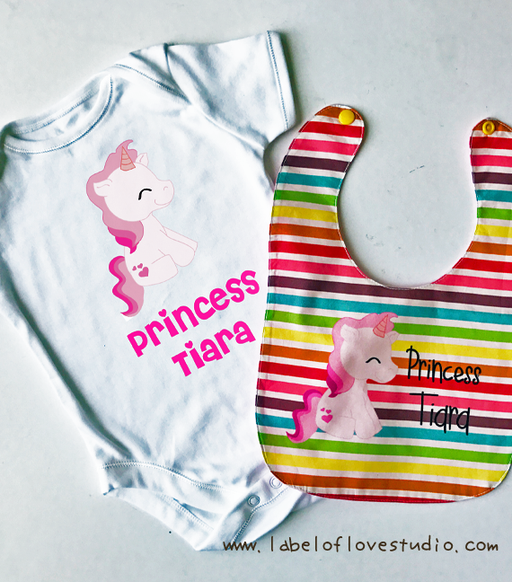 Personalised baby gift made up of a customised romper and a matching bib, sewn in Singapore.