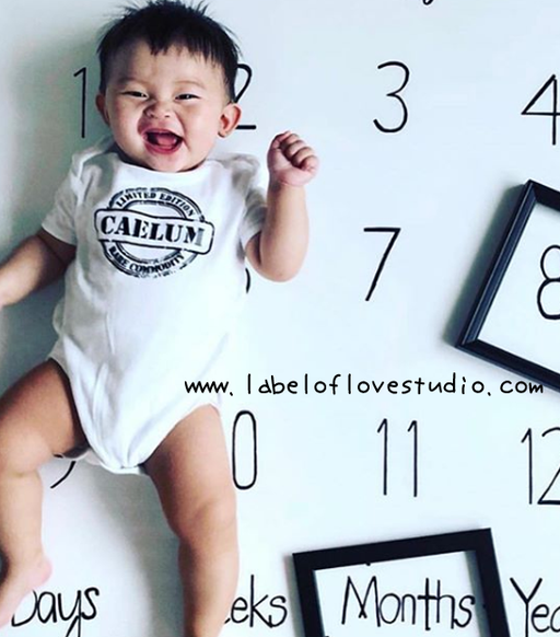 baby onesie singapore with a stamp print with name.